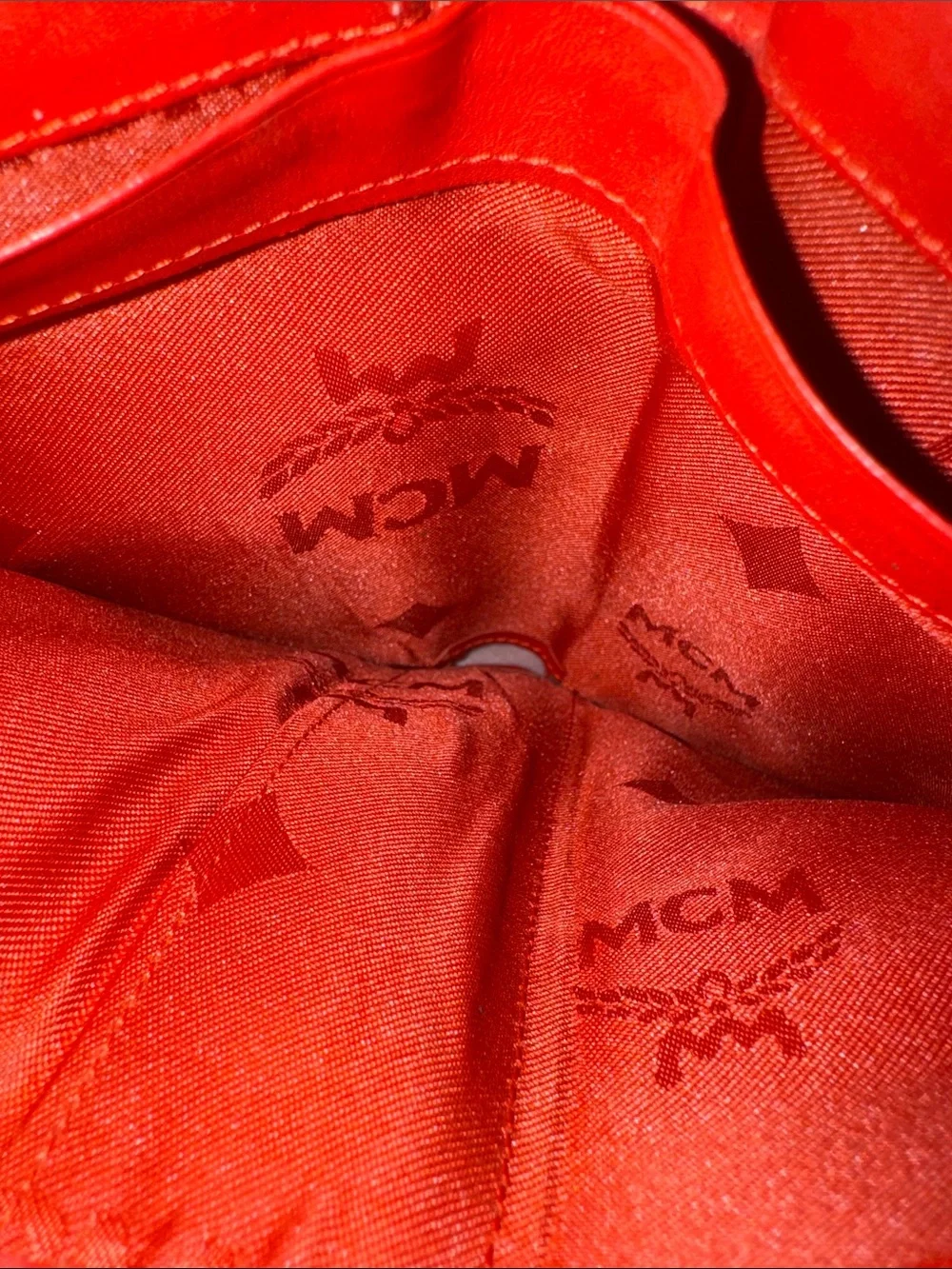 MCM Red Pebbled Leather Fold-Over Wallet.